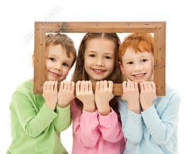 Three happy smiling kids looking picture frame