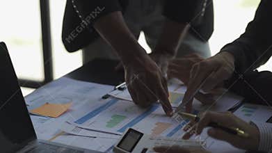 Business team meeting to analyze and discuss the financial report situation in