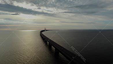 Colorful sunset by the bridge between Sweden and Denmark over the Oresund strait