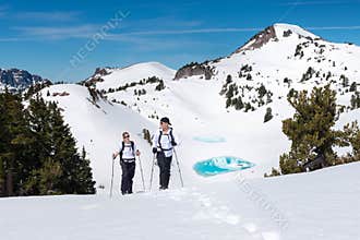 Hikers Trek Through a Snowy Mountain Landscape