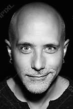 Bald man portrait half smile