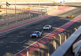 Dubai, UAE - 01.14.2023 - Racing cars on Dubai Autodrome circuit during Hankook 24 hours challenge race. Sports
