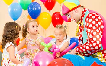 Children kids girls and clown on birthday party
