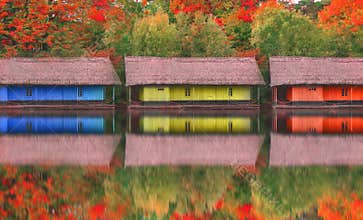 The old wooden house on the lake in the autumn season