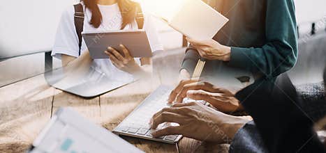 Young adult happy smiling Hispanic Asian student wearing headphones talking on online chat meeting using laptop in university