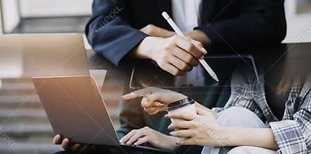 Young adult happy smiling Hispanic Asian student wearing headphones talking on online chat meeting using laptop in university