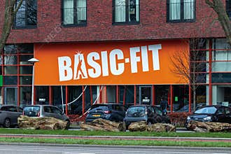 Basic-Fit logo on a huge billboard sign above the gym.