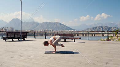Caucasian beautiful woman doing yoga in the park. Be H3althy