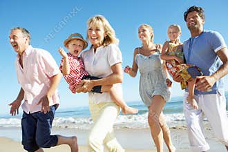 Multi Generation Family Enjoying Beach Holiday