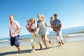 Multi Generation Family Enjoying Beach Holiday