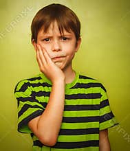 Young kid boy child toothache pain in mouth,