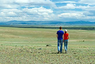 Young couple hiking steppe