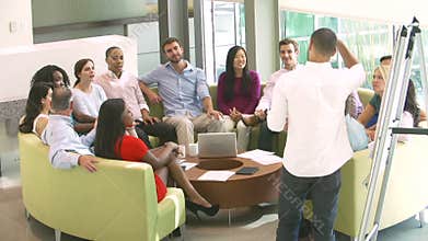 Businessman Leading Brainstorming Session With Colleagues
