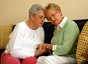 Senior friends comfort/prayer