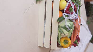 Basket with vegetables and measuring tape.