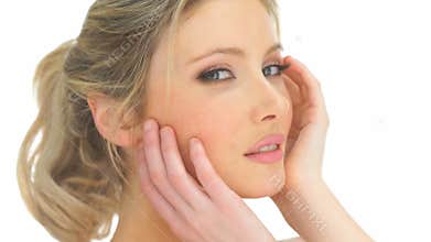 Beauty blonde woman touching her face