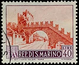 1957 San Marino 40 Lire stamp featuring a medieval arched bridge.