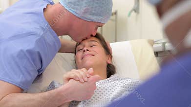 Woman Undergoing IVF Treatment With Partner In Hospital