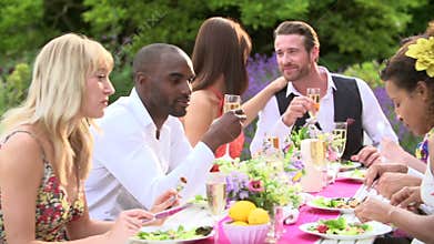 Friends Enjoying Outdoor Dinner Party Together