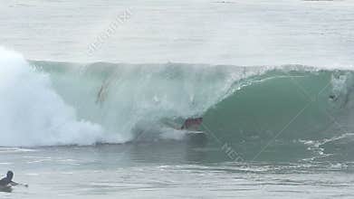 Man Surfing a Tubing Wave in Santa Cruz California