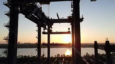 Sunset Silhouette of Industrial Crane