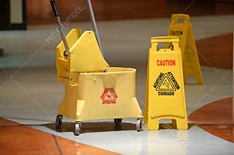Janitorial Mop and Caution Sign