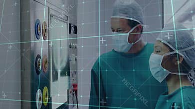 Technicians pointing touchscreen pressing button adjusting dials and switch for medical calibration