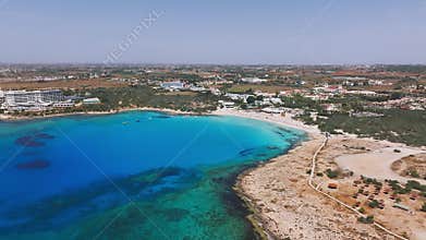 Aerial view of Ayia Napa coastline with beaches and resorts