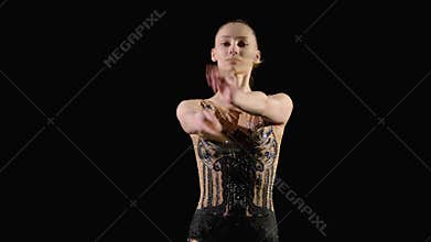 Lovely elegant rhythmic gymnast performing mills elements with clubs