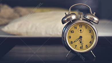 Vintage alarm clock in bedroom