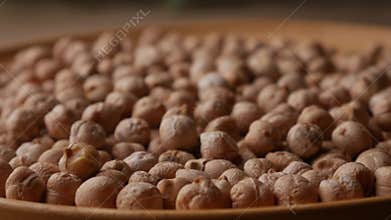 Raw Chickpeas on a rustic wooden table. Dry chickpea background close up.