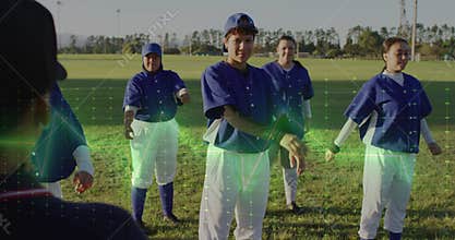 Stretching group of five women practicing drill on park field, with baseball jerseys and cleats