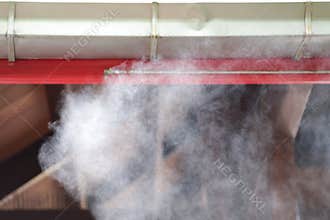 Mist spray head to increase humidity in the air. Increasing water vapor in the air can help lower temperatures.