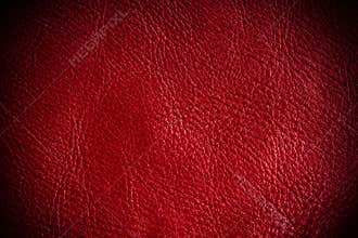 Red textured leather grunge background closeup
