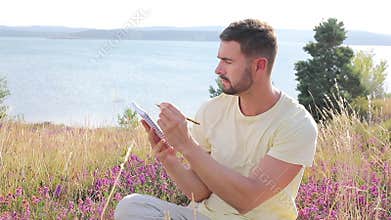 Author writing around inspiring nature