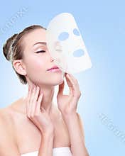 Relax Young woman with cloth facial mask