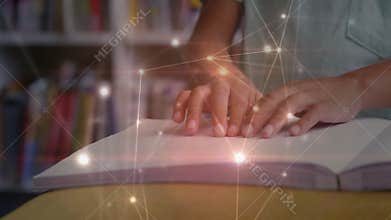 Hands positioning fingertips on Braille book while network overlay growing, showing knowledge flow