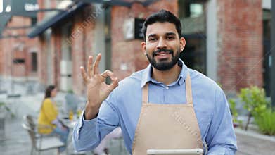 Hindu Waiter with Tablet