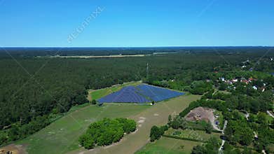 Solar panel plant make sustainable energy. Dramatic aerial view flight drone