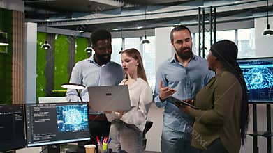 Team of programmers in office automating repetitive tasks using AI scripts