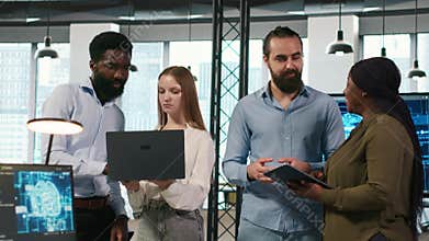 Portrait of teamworking programmers in office developing apps using AI
