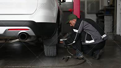 Mechanic Changing Car Tire