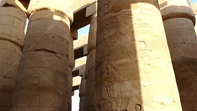 columns in karnak temple with ancient egypt hieroglyphics
