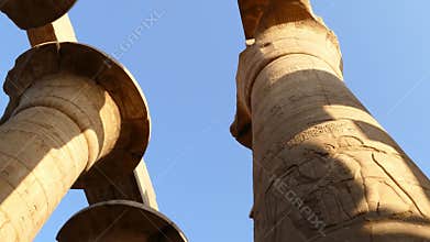 top of columns in karnak temple with ancient egypt hieroglyphics