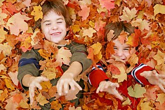 Boys Playing in the Leaves