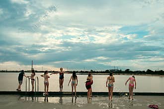 Children getting ready to jump from the pier - Australia