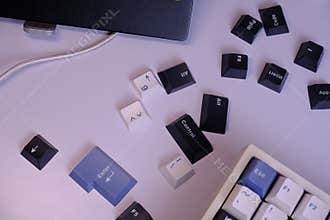 Scattered PBT Doubleshot Keycaps on a Clean White Desk, Coloured White, Blue, and Black