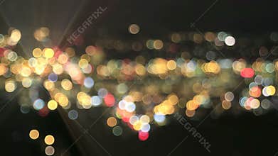 Defocused City Lights with Moving Car Beams Bokeh Background