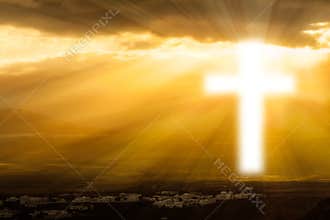 Religious cross glowing in heaven