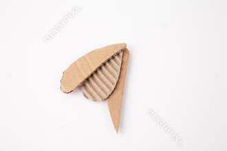 three pieces of corrugated cardboard on a white background. part of larger creative DIY craft project,